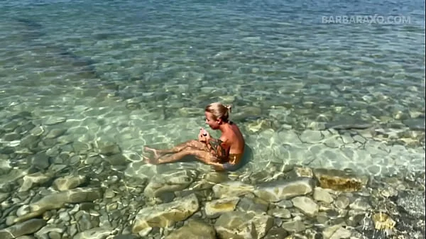 Slender tanned blonde gets fucked on the beach by the sound of waves during a photo shoot