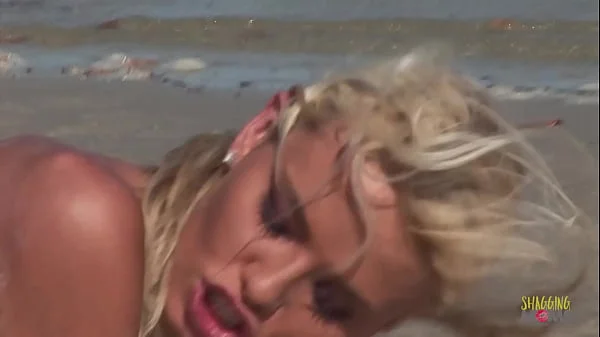 Passionate fucking on the beach with a stunning blonde with big tits