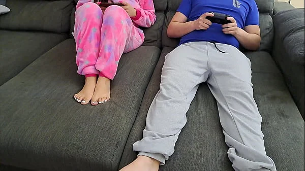 Stepsister sucks stepbrother and eats his sperm while he plays video games