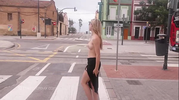 Stunning girl topless in the streets at sunrise