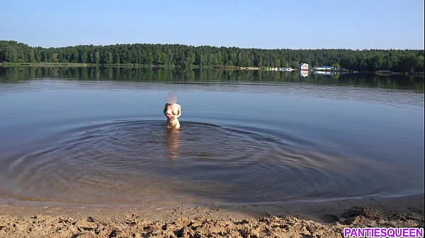 Naked girl goes skinny dipping in public beach