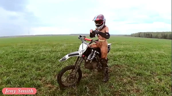 Naked woman riding a Dirt Bike