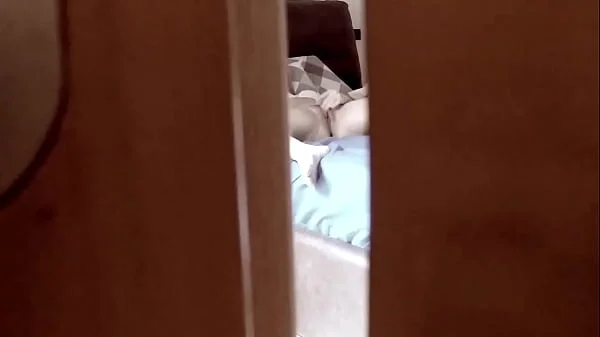 Spying behind a door a teen stepdaughter masturbating in bedroom and coming very intense